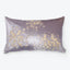 Luxurious rectangular pillow with golden splatter design adds decorative flair.