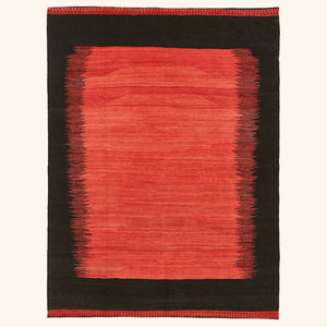Vibrant red gradient rug with minimalist design and black border