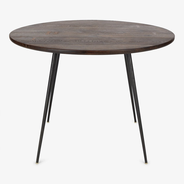 A rustic and elegant wooden table with modern slender legs.
