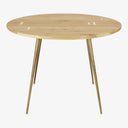 Modern round wooden table with metal legs showcasing natural beauty.