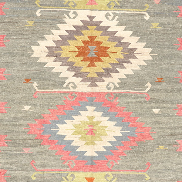 Hand-woven rug showcasing intricate geometric patterns with tribal influences.