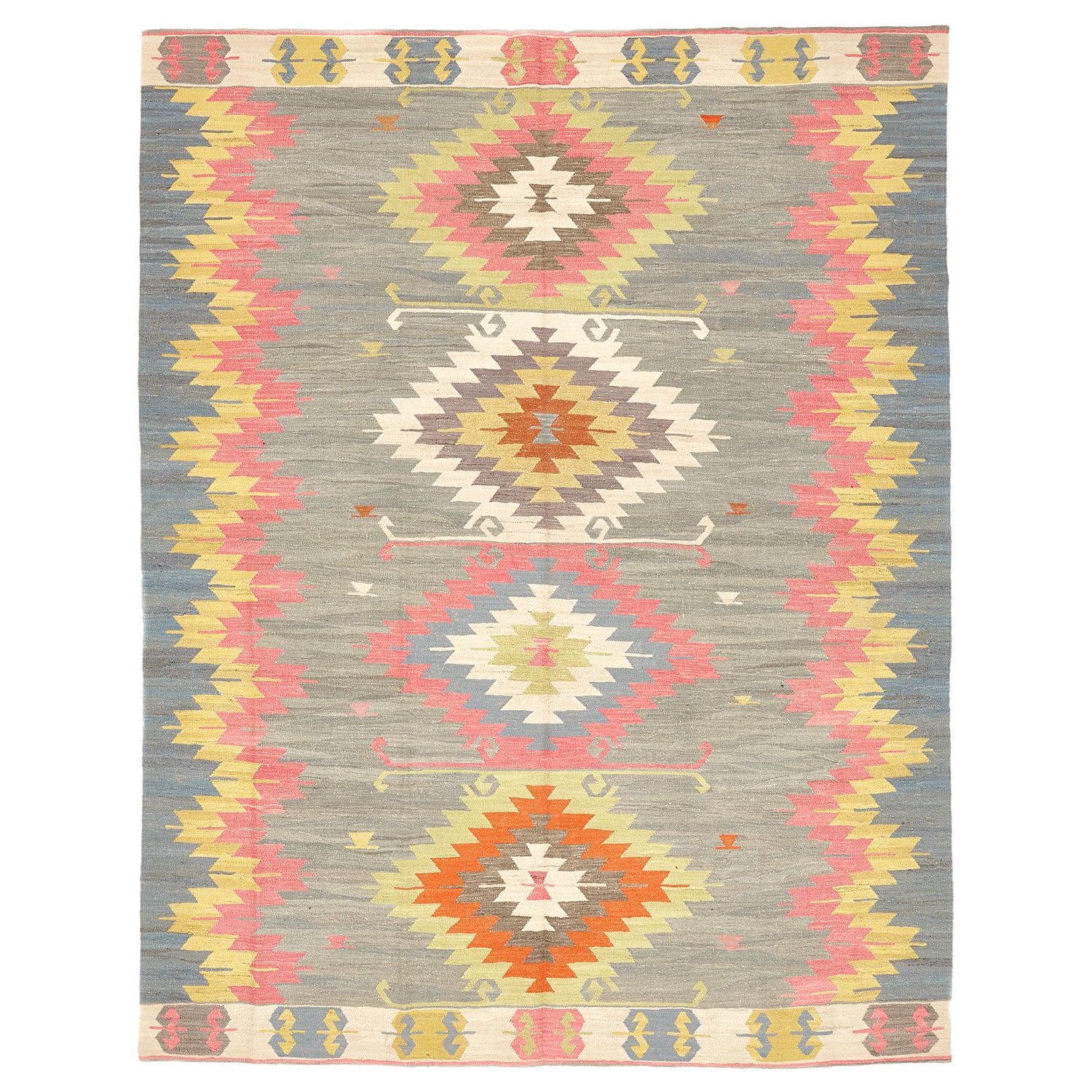 Vibrant tribal rug with symmetrical diamond patterns in muted background.