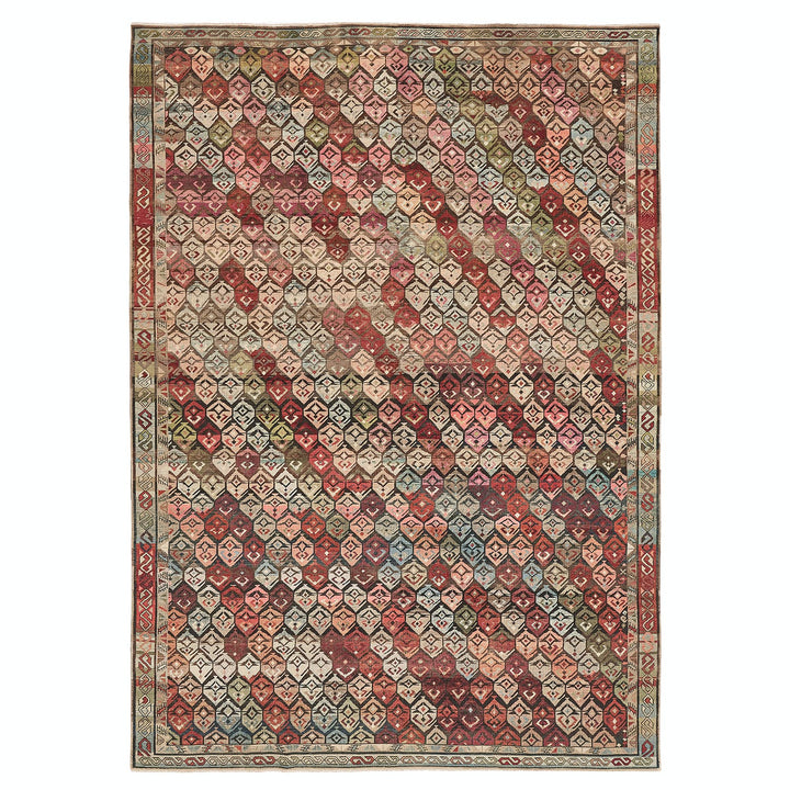 Intricate geometric patterned rug in Middle Eastern or South Asian style.