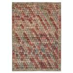 Intricate geometric patterned rug in Middle Eastern or South Asian style.