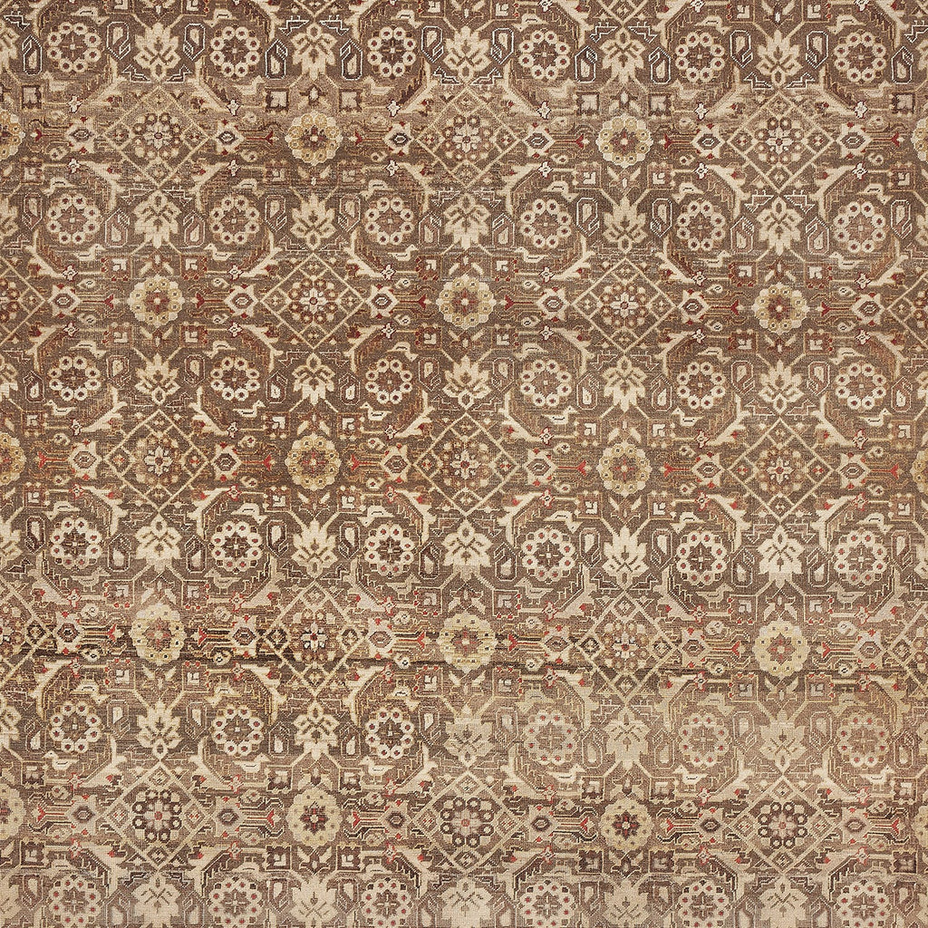 Exquisite handmade carpet featuring intricate symmetrical design and rich colors.