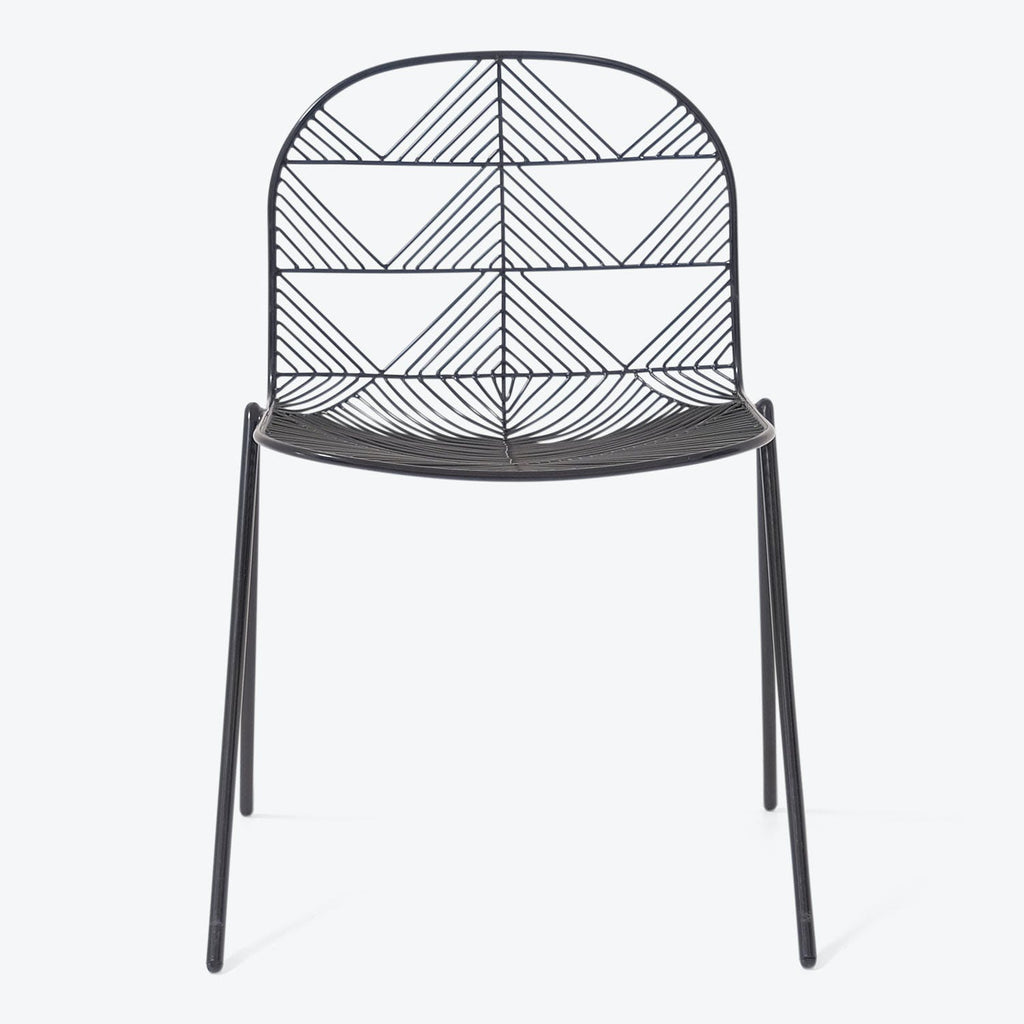 Contemporary wire chair with minimalist design and intricate geometric patterns.