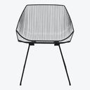 Modern, minimalistic chair with sleek black metal frame and grid-like design.
