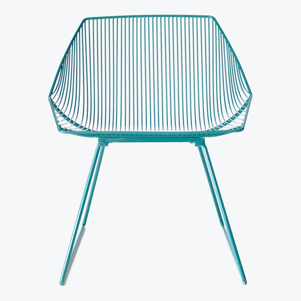 Modern teal chair with sleek lines and metal frame design.