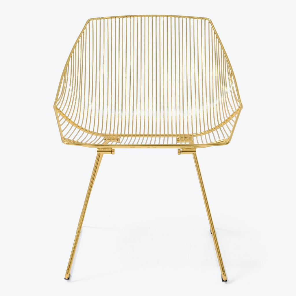 Modern chair with metallic gold finish and distinctive wire design.