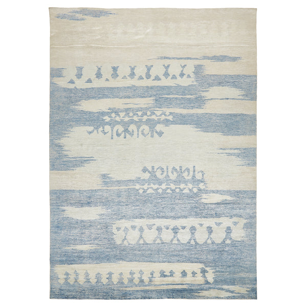 Contemporary rug with blue and off-white geometric patterns and motifs.