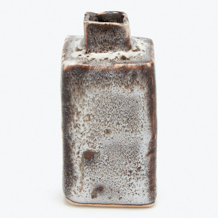 Handcrafted ceramic vase with gradient glaze finish against white background.