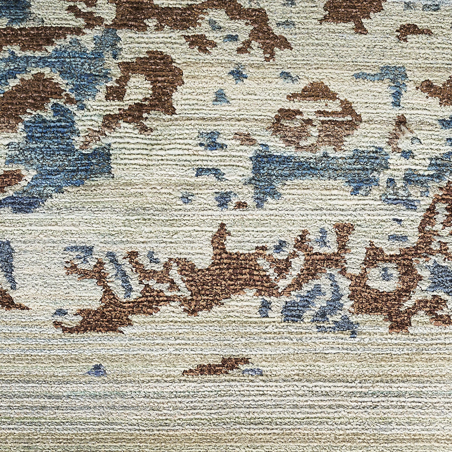 Abstract, weathered fabric with loop pile texture in brown and blue.