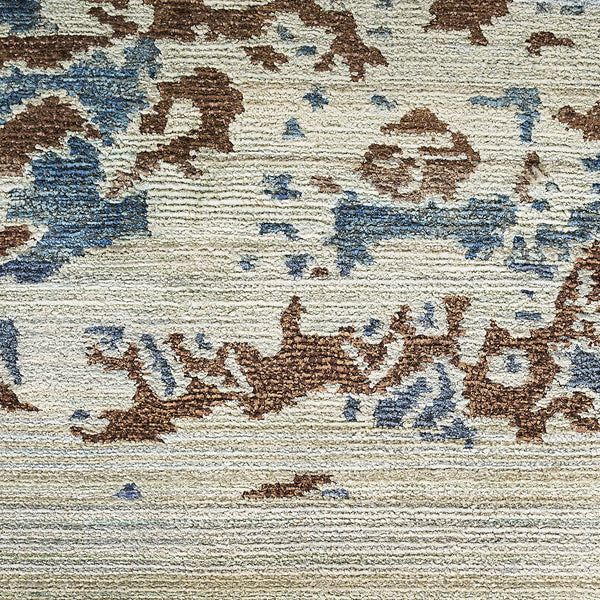 Abstract, weathered fabric with loop pile texture in brown and blue.