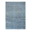 Abstract pattern featuring textured blue background with scattered darker splotches.