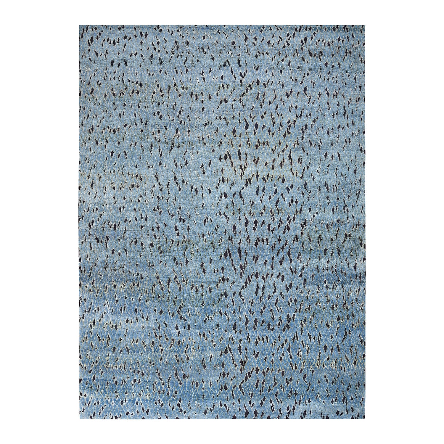 Abstract pattern featuring textured blue background with scattered darker splotches.