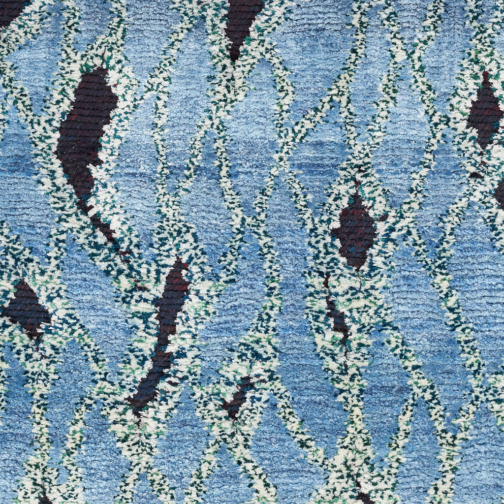 Close-up of a soft and plush blue patterned fabric.