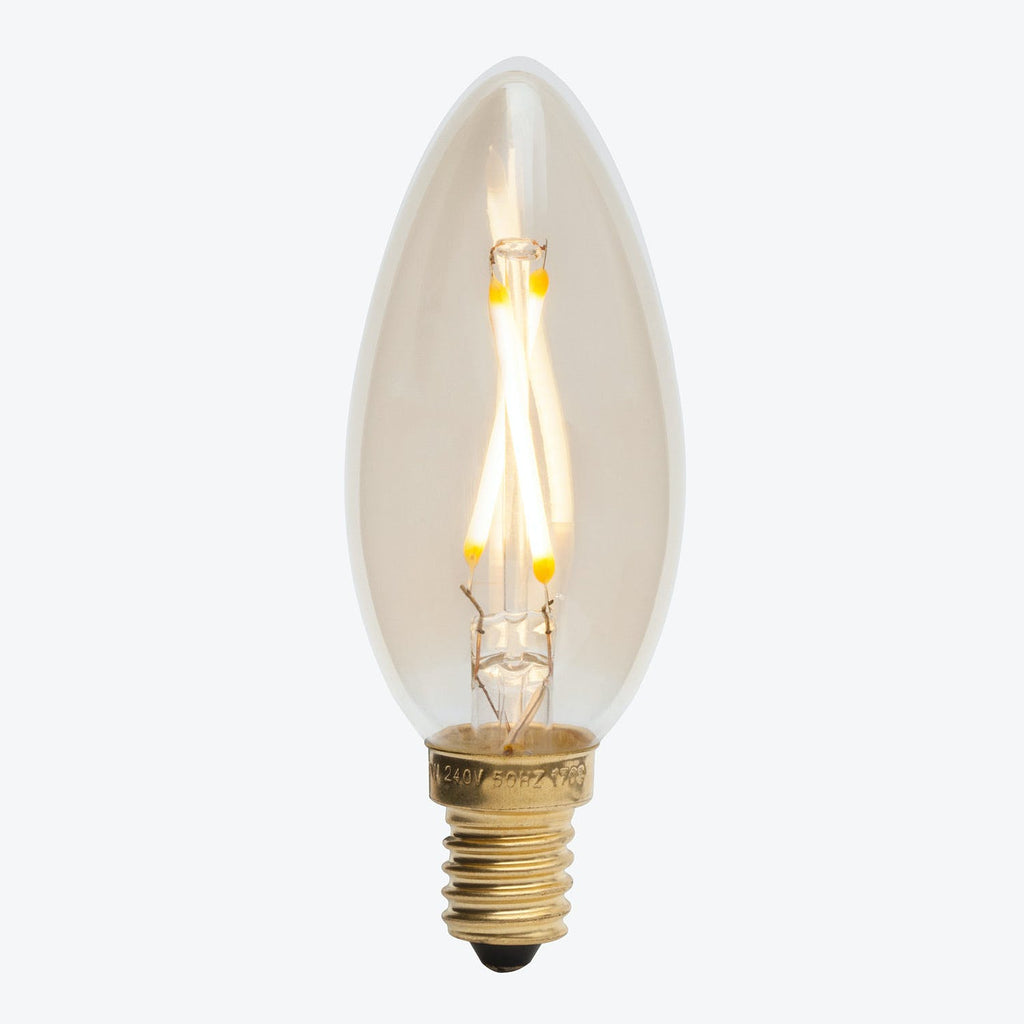 Caption: Vintage-style Edison bulb with glowing filament creates warm, nostalgic ambiance.