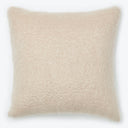 Soft, fluffy square pillow in light beige, perfect for comfort.