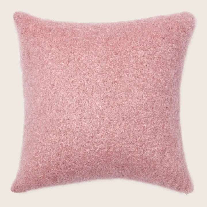 Soft and fluffy pink cushion adds a touch of elegance.