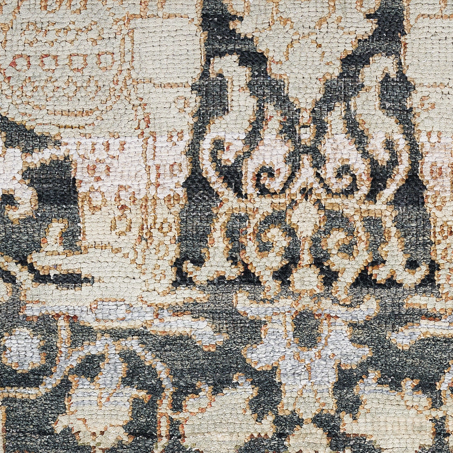 Close-up of an antique textile featuring ornate baroque design.