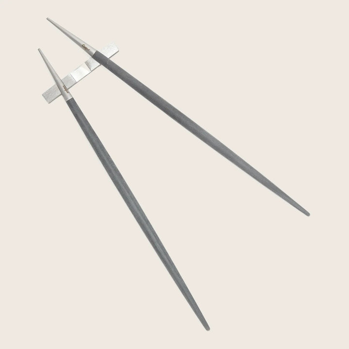 Two graphite drawing pencils with extenders, providing comfort and precision.
