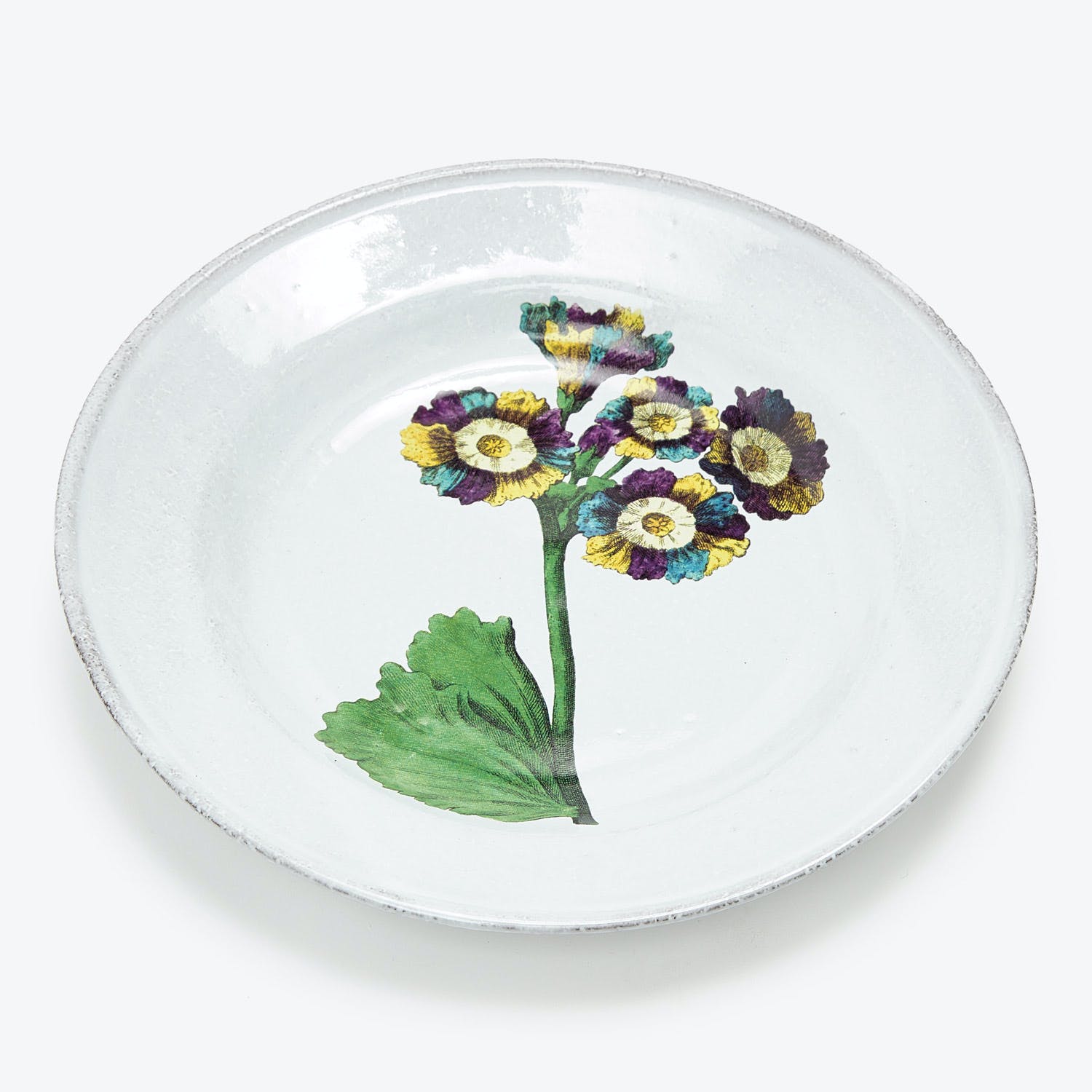 Handcrafted ceramic plate with rustic design featuring blooming floral illustration