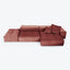 Modern modular sofa in rich maroon leather with tufted cushions.