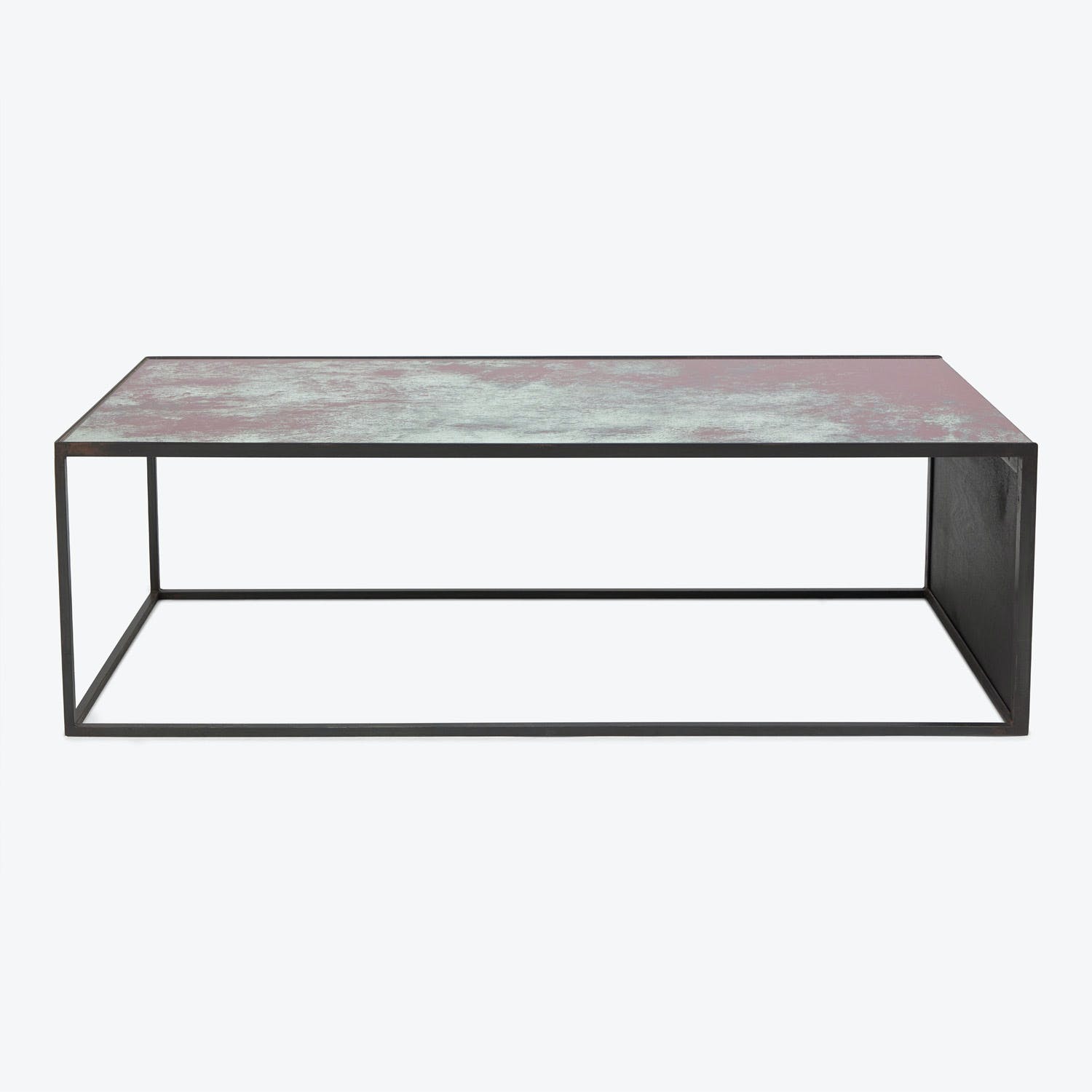 Minimalist rectangular coffee table with textured pink-gray tabletop and black frame.