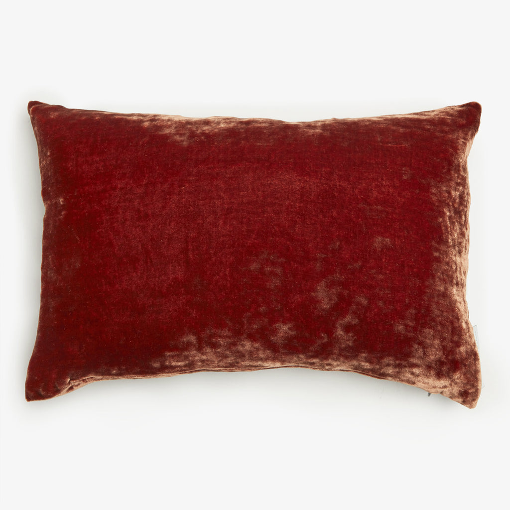 Luxurious and cozy rectangular pillow with plush velvety texture.