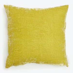 Vibrant yellow square pillow with plush texture and soft fabric.