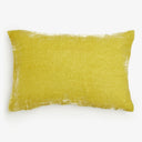 Soft and fluffy yellow pillow adds comfort to any space.