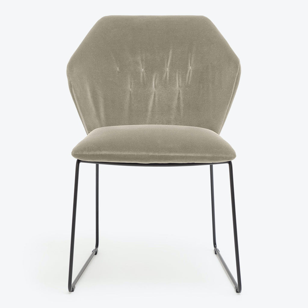Modern chair with minimalist design, featuring soft upholstery and sleek legs.