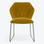 Modern mustard yellow velvet chair with sleek metal legs.
