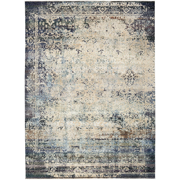 Distressed area rug blends vintage charm with intricate floral patterns.