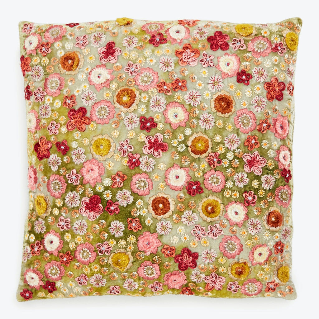 Decorative floral embroidery pillow adds cozy and artistic flair.