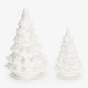 Two white glitter Christmas trees, one large and one small.