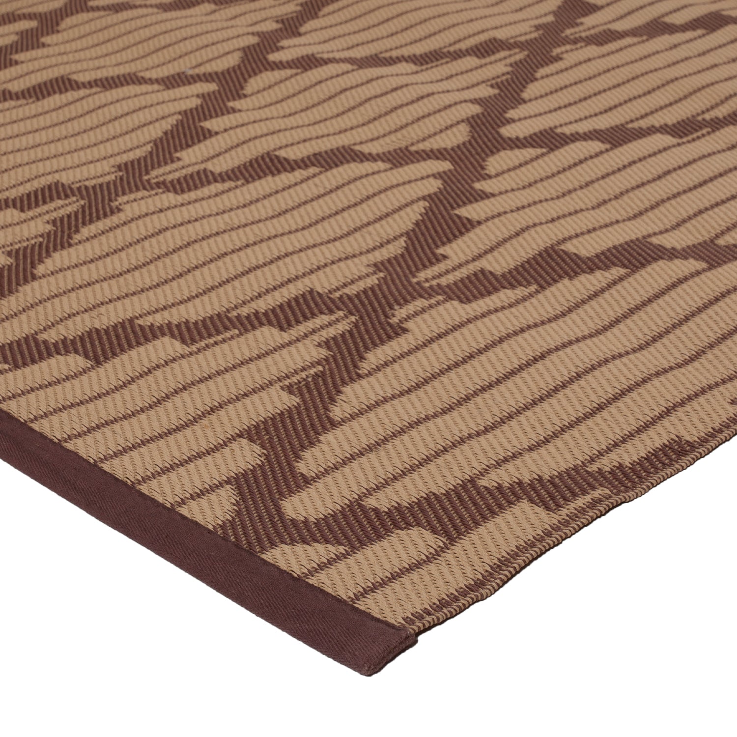 Close-up of a patterned rug with dark brown and tan stripes.