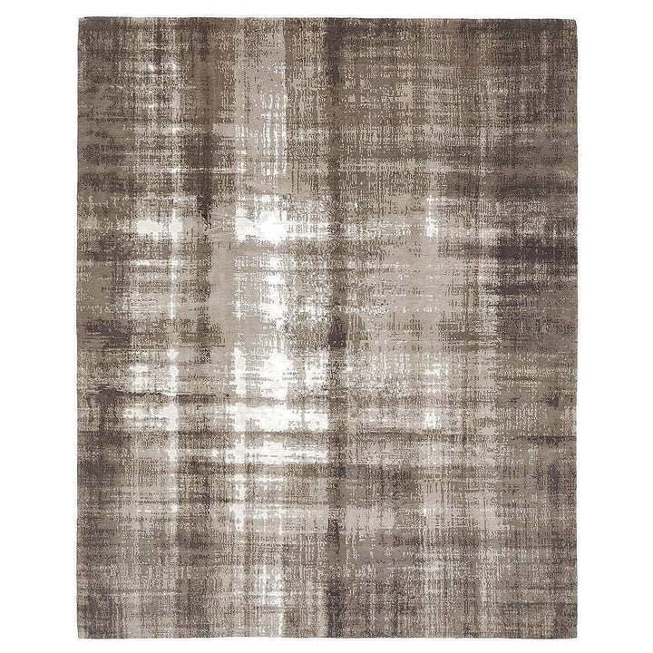 Rectangular rug with abstract design in taupe, beige, gray.