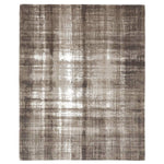 Rectangular rug with abstract design in taupe, beige, gray.