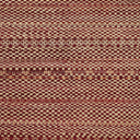 Close-up of a complex geometric textile pattern in red and beige.