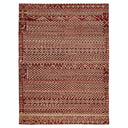 Intricately woven traditional rug featuring symmetrical geometric patterns in earthy tones.