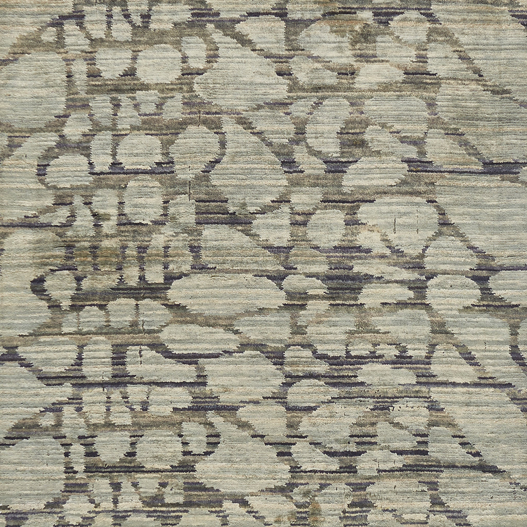 Close-up of abstract, distressed textile with neutral tones and fibrous texture.