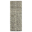 Neutral-toned runner rug with abstract pattern adds warmth to space