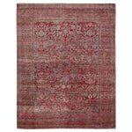 Intricate, symmetrical oriental carpet in rich reds and blues.