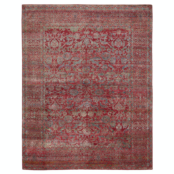 Intricate, symmetrical oriental carpet in rich reds and blues.