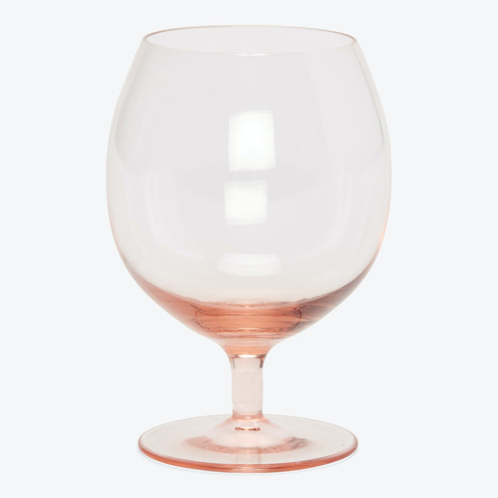 Single, empty wine glass with large bowl designed for red wines.