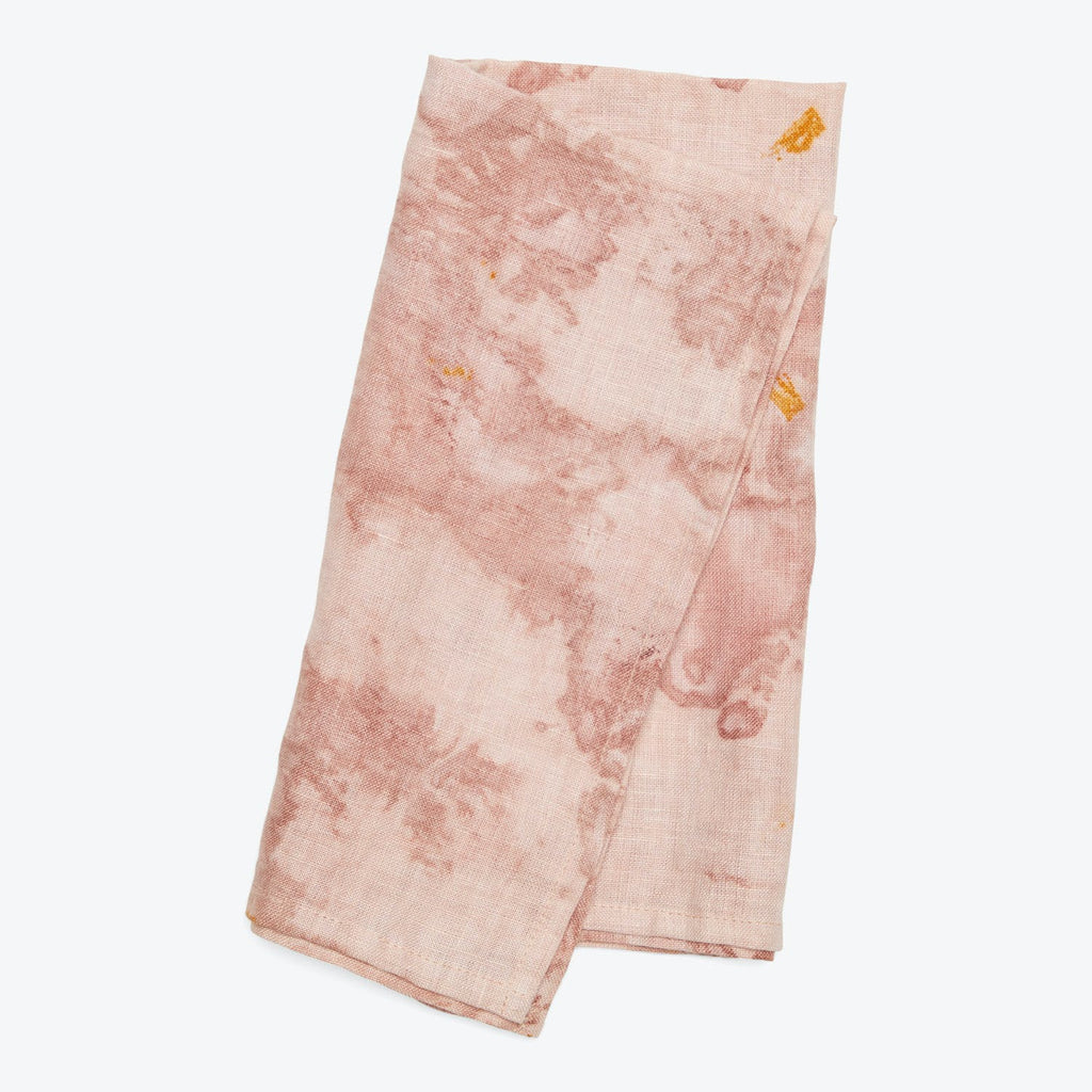 Uneven, splotchy pink fabric with darker blotches and yellow stains.