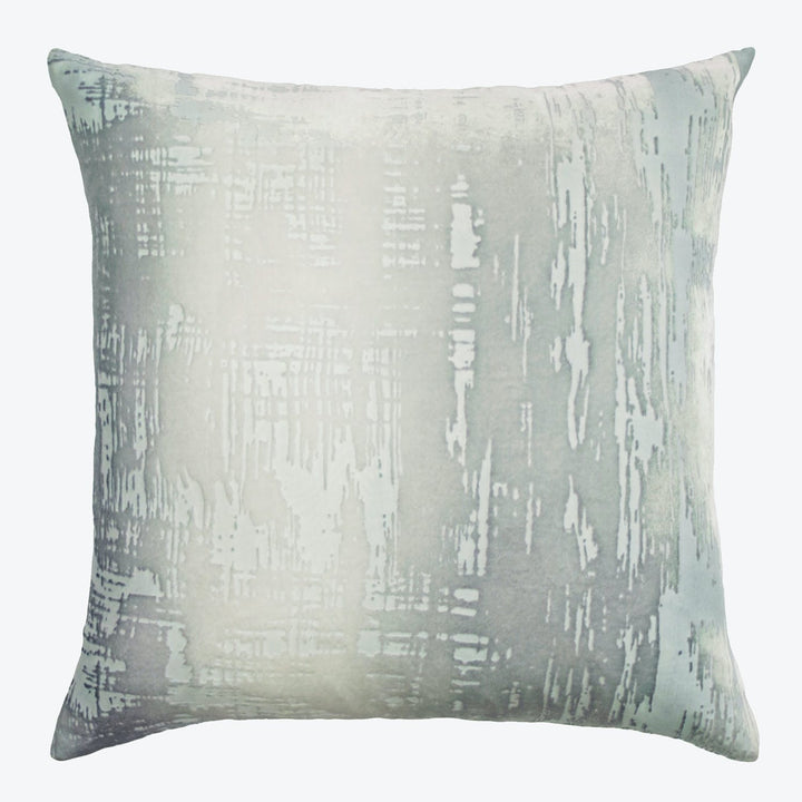 Abstract gray and white decorative pillow with textured modern design.