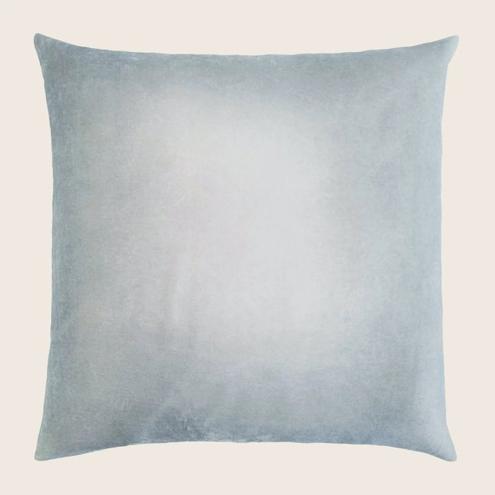 Soft, neutral square pillow with gradient color for versatile decor.
