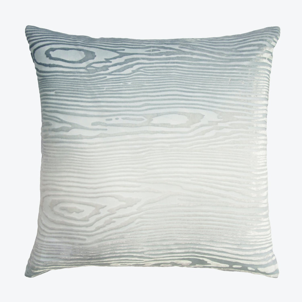 Square pillow with wood grain-like design in soft grays.